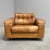 Mid century lounge chair by De Sede. Design by Robert Haussmann, Switzerland 1970s. Wooden frame with cognac leather...