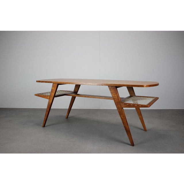 A beautiful Danish mid-century coffee table produced in Denmark in the 1960s, crafted from warm teak veneer and designed...