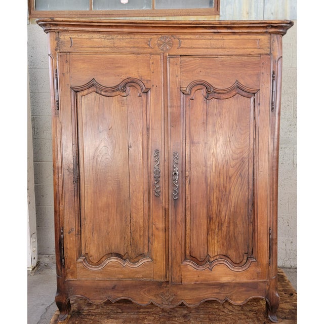 Two door armoire / storage cabinet measuring only 65.75 inches high. County French, Louis XV dating 1790-1810. Made in...