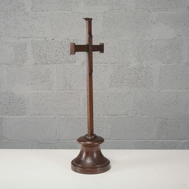 This antique solid wood altar cross, dating back to the 19th century, is a fine example of period devotional...