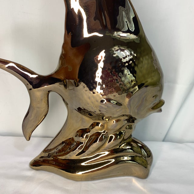 Add a striking splash of retro glamour to your space with this vintage mid-century modern stylized angelfish sculpture....