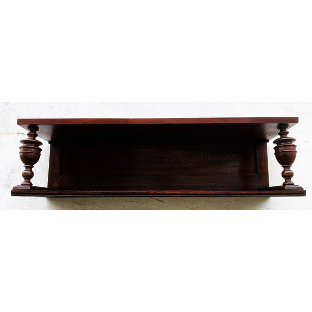 Antique, classic solid oak wall shelf from the late 19th century in the Neo-Renaissance/Historicist style. Turned columns,...
