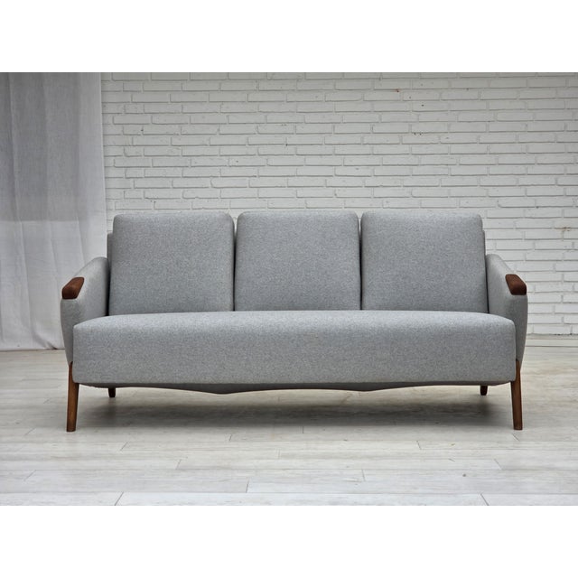 1960s, Danish design by Arne Hovmand-Olsen. 3-seater sofa model 490. Oak legs and teak nails. Completely renovated-...