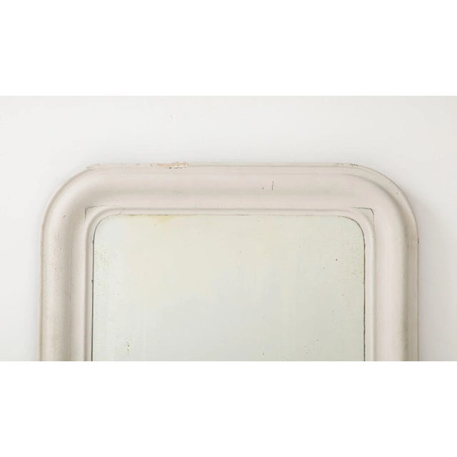 This early 20th-century French Louis Philippe mirror exudes timeless elegance with its exquisite design. Encased in a...