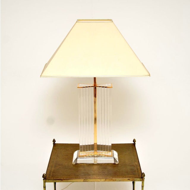 A large and impressive vintage French acrylic glass and brass table lamp. This was recently imported from France, it dates...