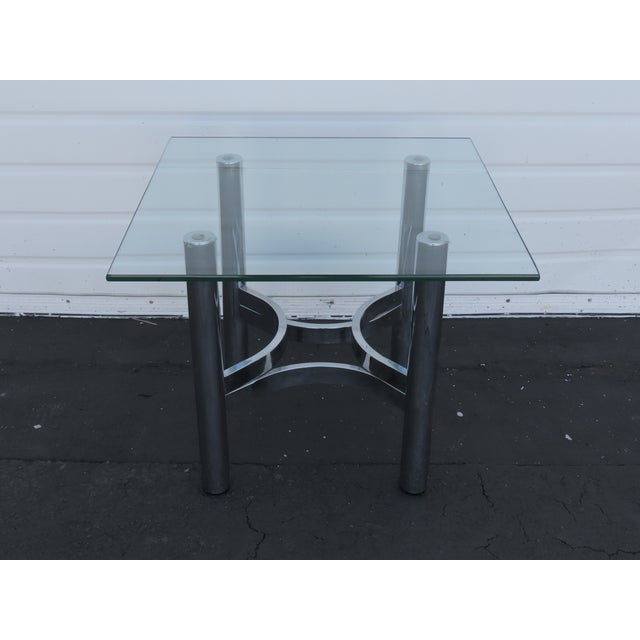 This beautiful Side Table is made out of metal, and glass. The Table has Hollywood Regency design, very interesting base...