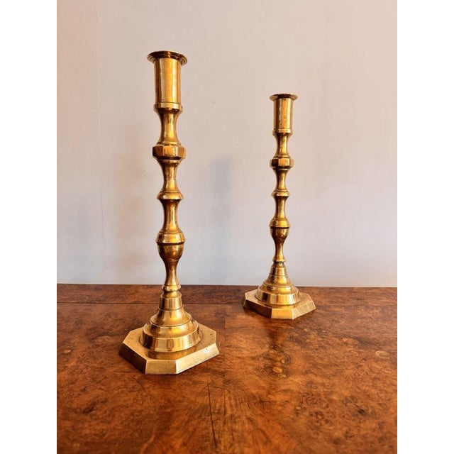 Quality pair of large antique Victorian brass candlesticks, having a quality pair of brass candlesticks with circular...