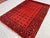 A vintage Afghan Turkmen Ersari rug carrying eleven rows of small quartered Tekke-type güls in a tight, disciplined grid...