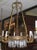This lovely chandelier in the French Empire style features a central ring with reticulated guilloche motif, hanging...