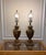 Pair of antique brass Renaissance Style Metal Table Lamps with a Lion Head and Drape Design. This Pair measures 29" tall...