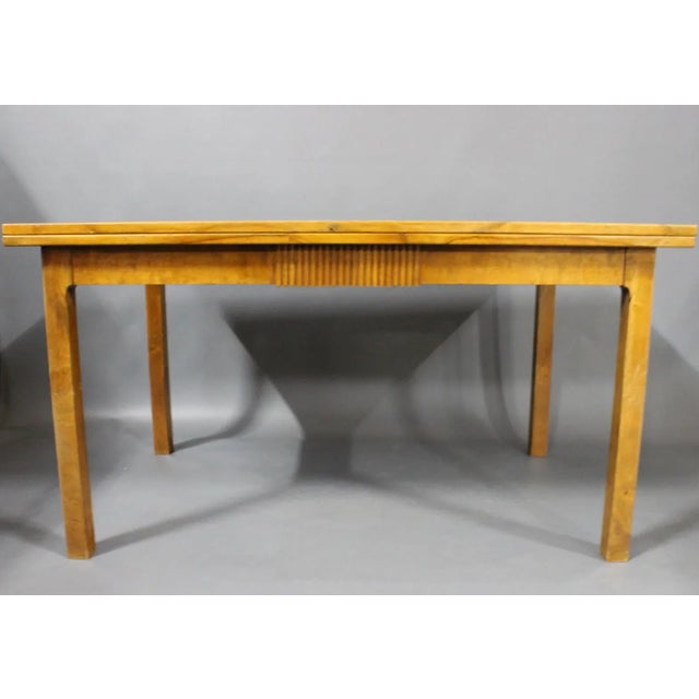 This extendable dining table was made by a Danish cabinetmaker in the 1940s. The table is made from walnut and each...