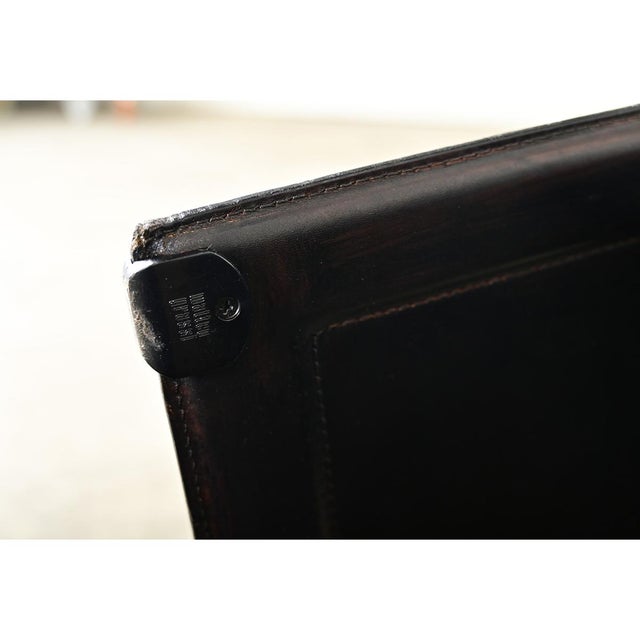 Dimensions: 33 ¼” H x 24 ½” W x 19 ½” D Pair of vintage Italian black leather armchairs by designer Tito Agnoli for the...