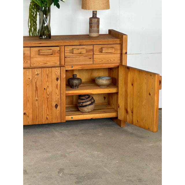 Danish pine sideboard by Hans Frydendahl, dating from the 1970s. Its long, low structure is framed by substantial upright...