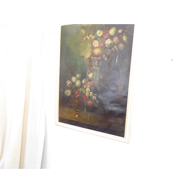 This 18th Century oil painting of flowers is recently framed in a whitewashed wood frame. There is a name on the back that...