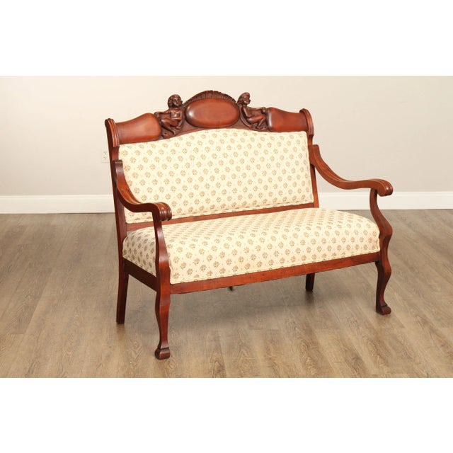High Quality Antique Late 19th Century Custom Upholstered Mahogany Finish Settee with Carved Figural Crest Rail