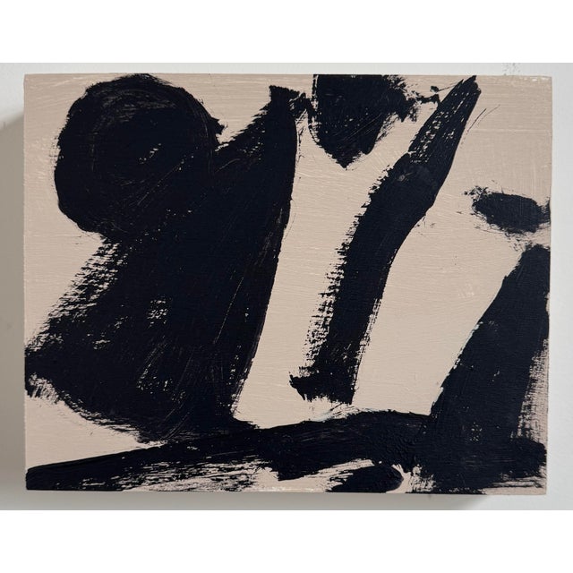 This abstract painting features bold, expressive black brushstrokes on a soft neutral background, creating a composition...