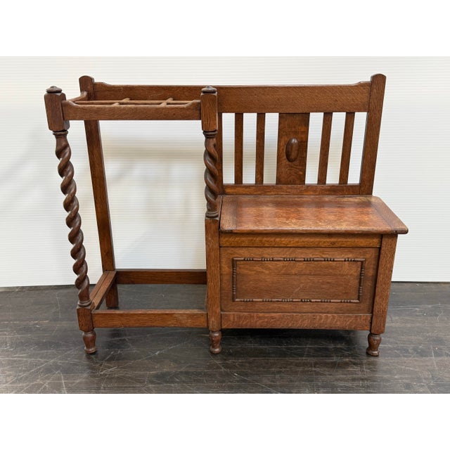 Design Plus Gallery presents an Antique Entry Way Bench. This superb English antique is made of solid oak wood and has...