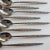 set of 8 stainless steel iced tea spoons.. beautiful floral pattern. 7.5"