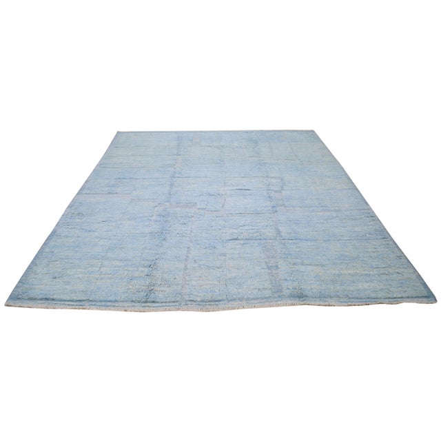 Hand-knotted with care using traditional rug-making techniques, this wool rug blends timeless craftsmanship with a modern...