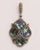 An amazing and unusual pair of dangle drop earrings featuring slices of abalone shell bordered with pave`-set, round,...