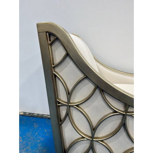 Stylish Caracole Social Butterfly Chair. Butterfly inspired sides, off white fabric. Original retail $2175. Showroom floor...
