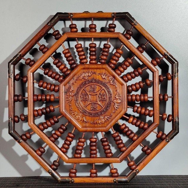 A striking octagonal Chinese abacus wall hanging crafted from rosewood (huali wood), designed in the traditional Bagua...