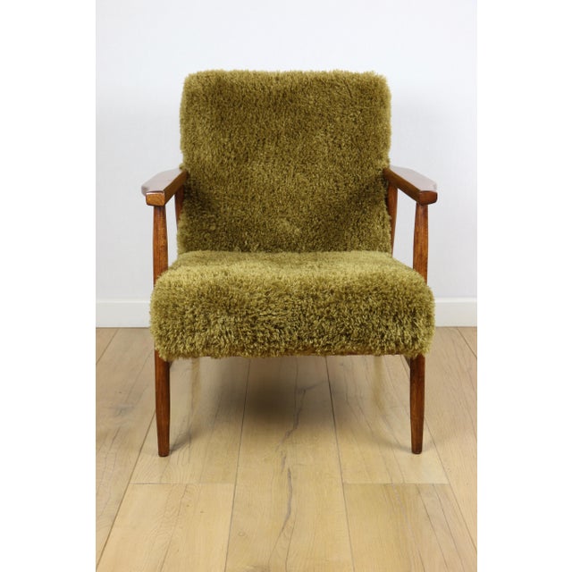 Vintage armchair from the 1970s, red fox colour with high pile Camel fabric. This armchair is similar to the very popular...