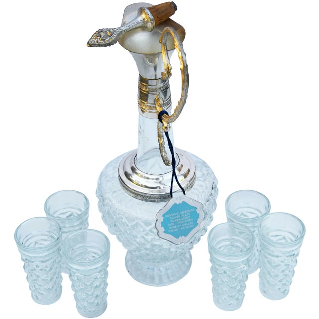 Vintage Italian handmade crystal decanter with cork stopper and six glasses. Featuring an intricate silver engravings,...