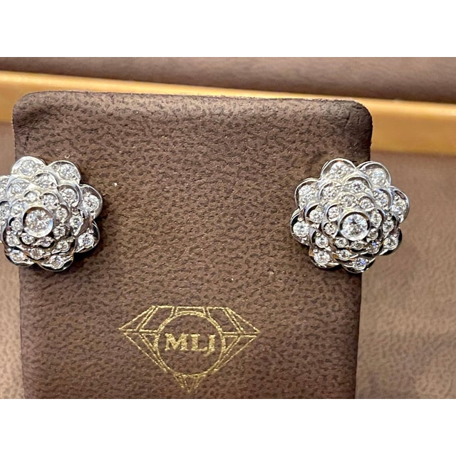 A fabulous pair of earrings with an enormous amount of look and sparkle! 2.8 carats of F-G color VS clarity diamonds set...