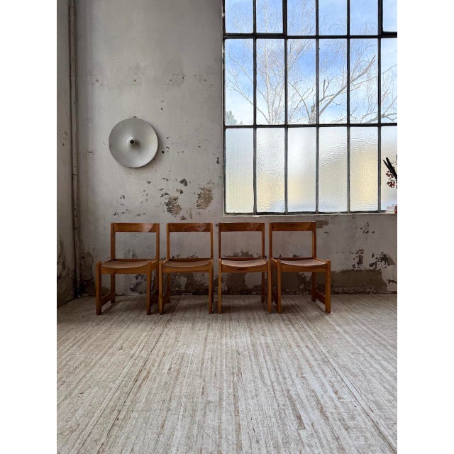 Set composed of 4 solid elm chairs from the 70s in the style of Maison Regain's creations. The seats are not original and...