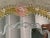 Important mirror with Murano glass transparent elements and pink flowers full of gold leaf. Oval mirror with venetian...