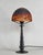 Daum A 1925-1930 French art deco lamp in wrought iron. The excellent forged base holds a beautiful Daum shade in colored...