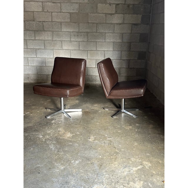 Wonderful pair of De Sede of Switzerland leather and chrome swivel chairs. These chairs are heavy and well made with thick...