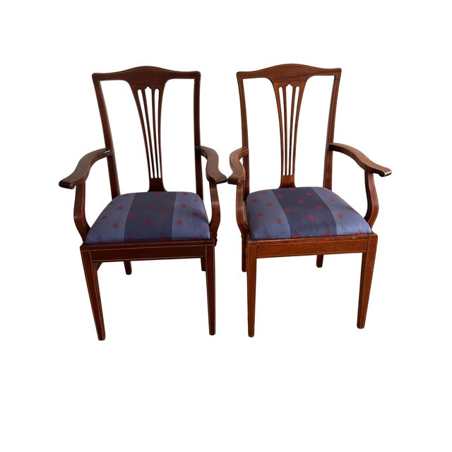 Elegant set of 14 antique dining chairs dating from the early 1900s, showcasing refined craftsmanship and timeless design....