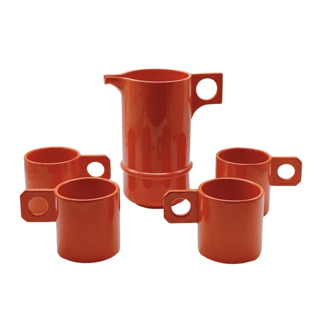 Splendid set of four orange cups with Il Picchio ceramic jug, (signature under the base) This piece has an attribution...