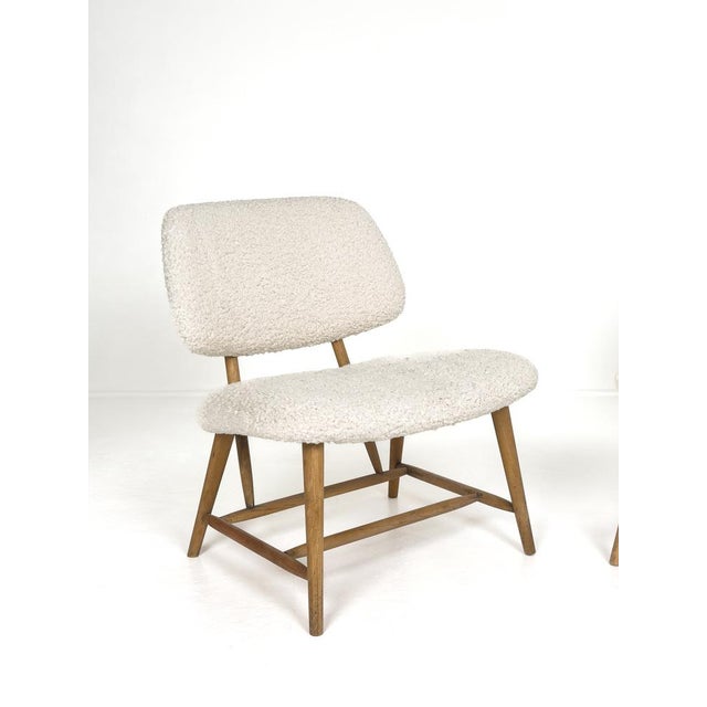 A charming pair of Swedish Modern lounge chairs designed by Alf Svensson and produced in Sweden during the 1950s. These...