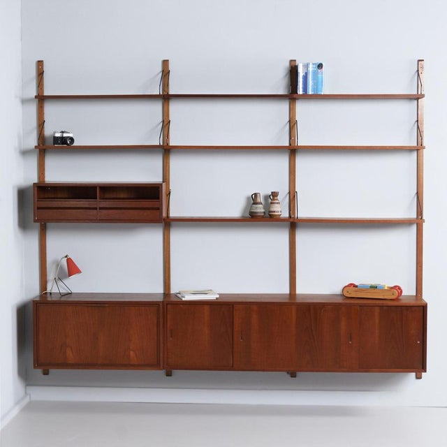Royal system wall system cadovius from the 1960s, a 15-piece modular danish wall unit with a light and open appearance....