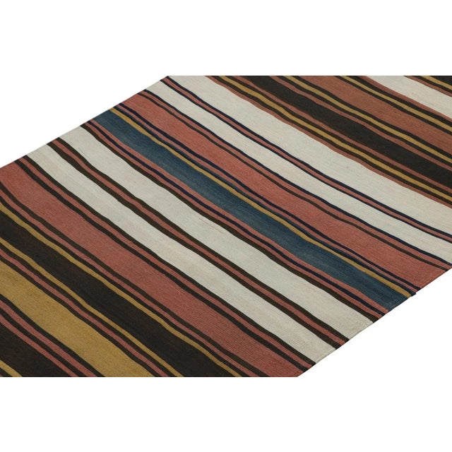 This vintage 5x11 Persian Kilim is a mid-century tribal rug believed to originate from the Shahsavan tribe—handwoven in...