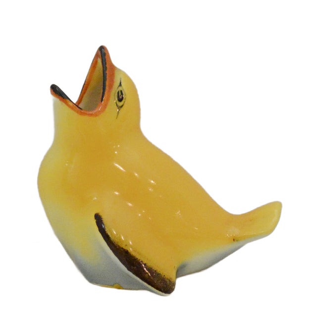 Add a touch of "Golden Era" British charm to your collection with this exquisite Royal Doulton "Fledgling" figurine (Model...