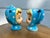 Cute as a button, these bright blue clad cheerful children are the Vintage Napco “Miss Cutie-Pie” sugar bowl with lid and...