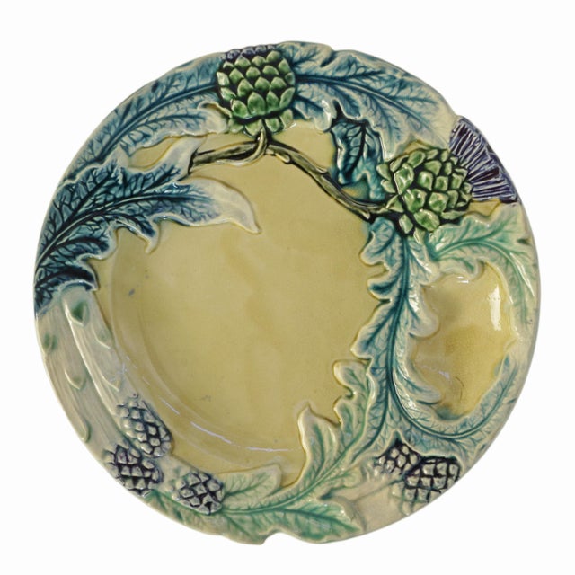 Add charm and character to your table or display with this set of four antique French majolica plates from the celebrated...