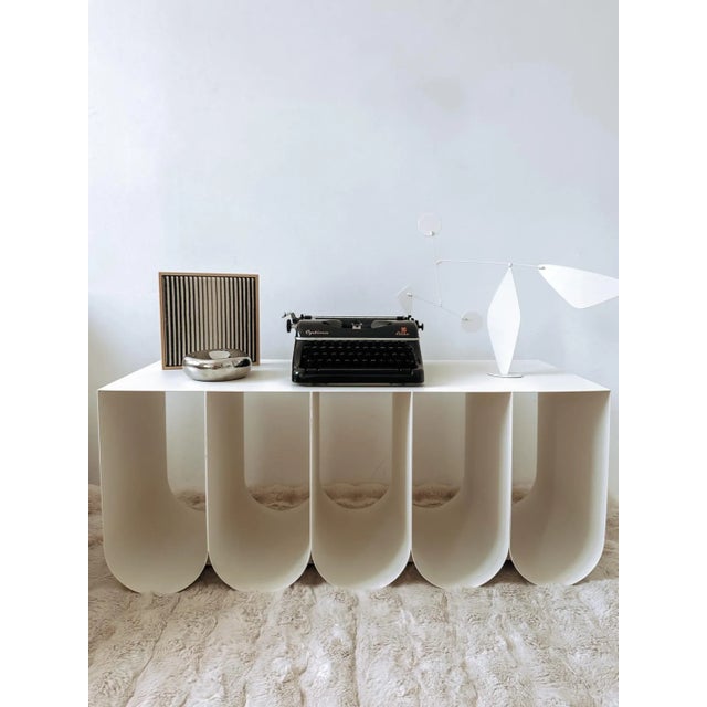 This vintage Optima Elite typewriter is more than just a writing instrument—it’s a striking design piece that instantly...