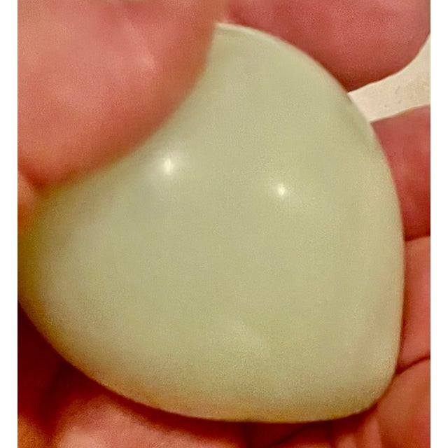 This is a nice carved milky light green polished stone fruit plum with simple attractive lines and slight color...