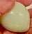 This is a nice carved milky light green polished stone fruit plum with simple attractive lines and slight color...