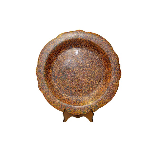 This multi-layer display plate boasts a striking fusion of colors and textures, creating a captivating piece that adds...