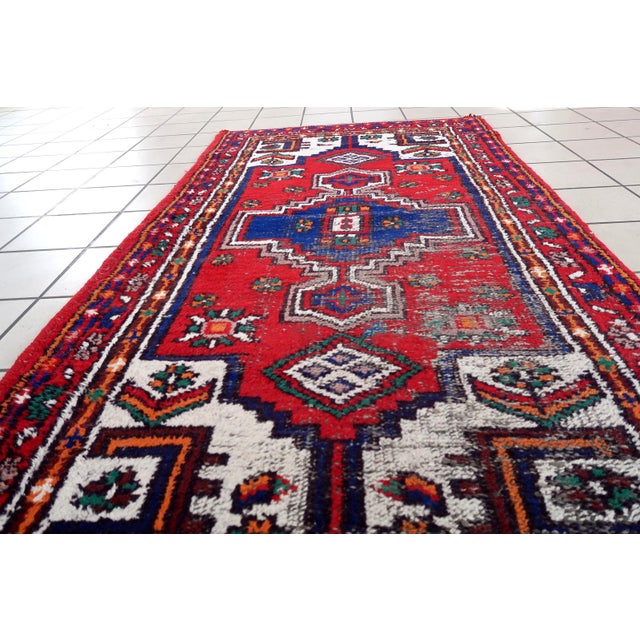 Handmade vintage Persian Hamadan rug in bright colors. The rug is from the end of 20th century in distressed condition....