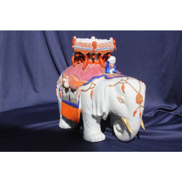 Late 19th century or early 20th century piece. This is a porcelain Elephant and Stupa possibly Japanese.