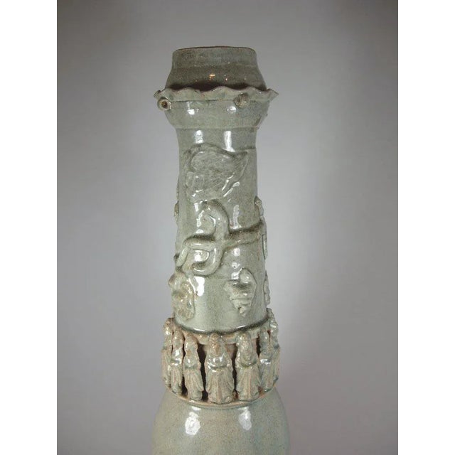 Up for sale is a tall Chinese Yingqing or Qingbai (light celadon) glazed porcelain funerary urn decorated with molded...