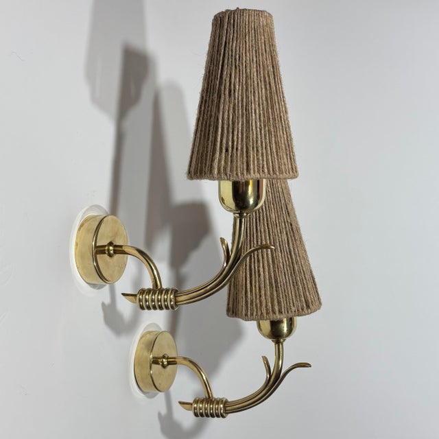 A beautiful pair of Scandinavian Mid-Century Modern wall lamps, produced in Sweden in the 1940s. While the manufacturer...