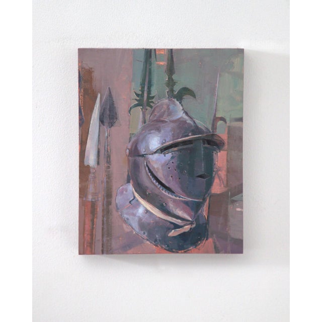 The painting features a gleaming helmet prominently displayed against a muted background, surrounded by an array of spears...